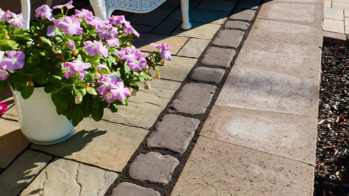 Stone steps with lighting connecting patio to upper lawn level