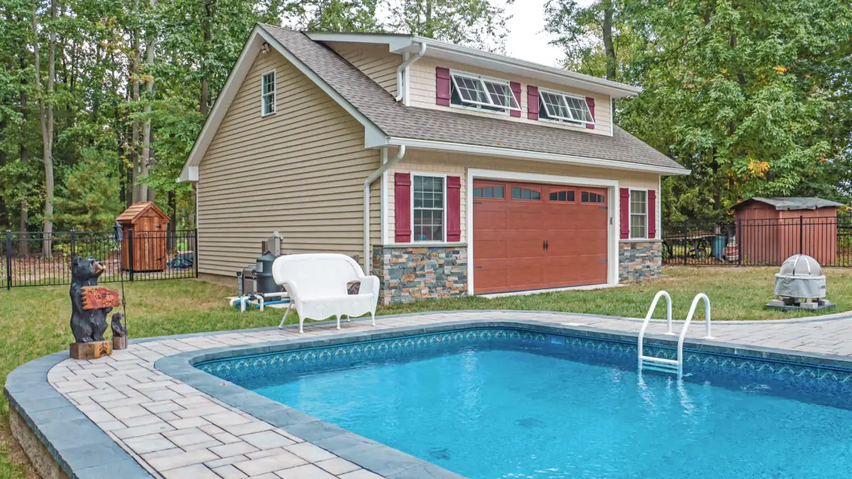 Large paver patio with outdoor dining and lounge zones