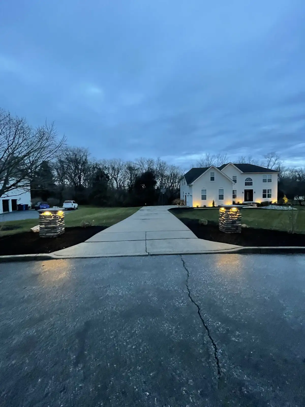 Landscape design with curved garden bed and seasonal color plantings